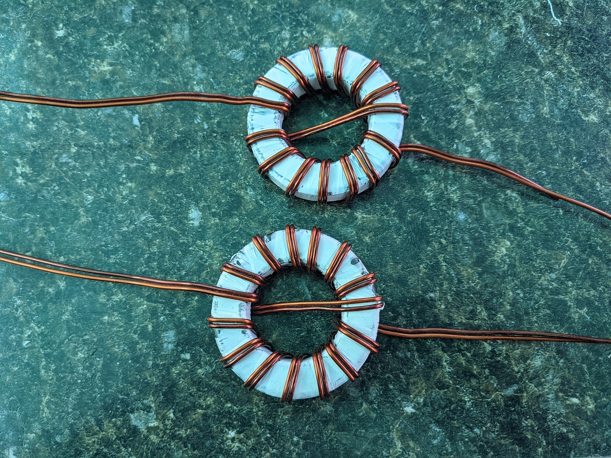 Toroid wound with magnet wire showing 7+1+7 turn pattern